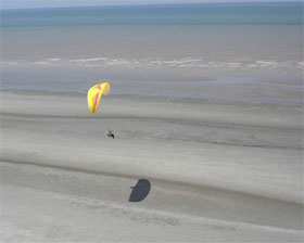 across clear blue skies and seas